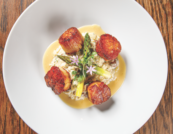 Plate of Hokkaido Scallops with Meyer Lemon sauce at 7th Avenue Social by Chef Everett Fromm