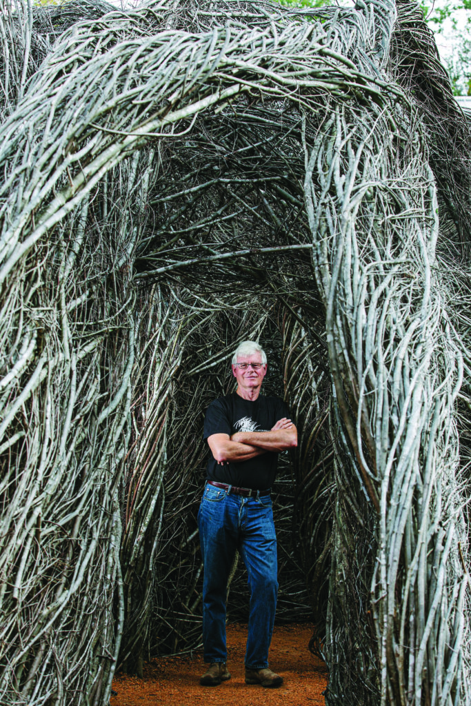 Patrick Dougherty with Homegrown, his stick sculpture installation at the NC Botanical Gardens in Chapel Hill.