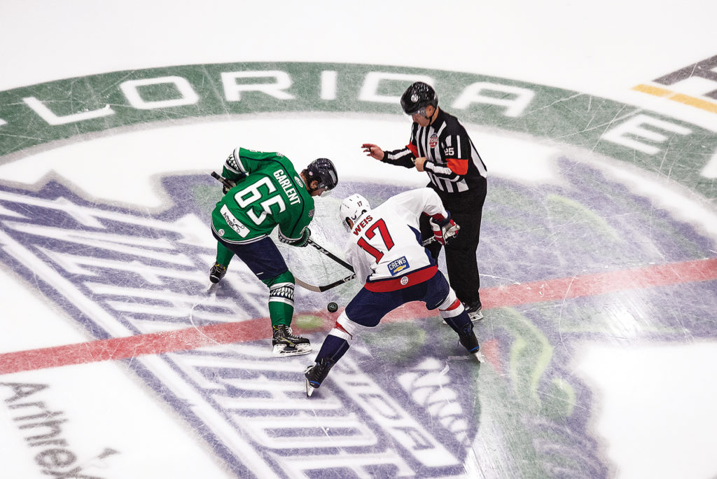 Florida Everblades player and opposing team member