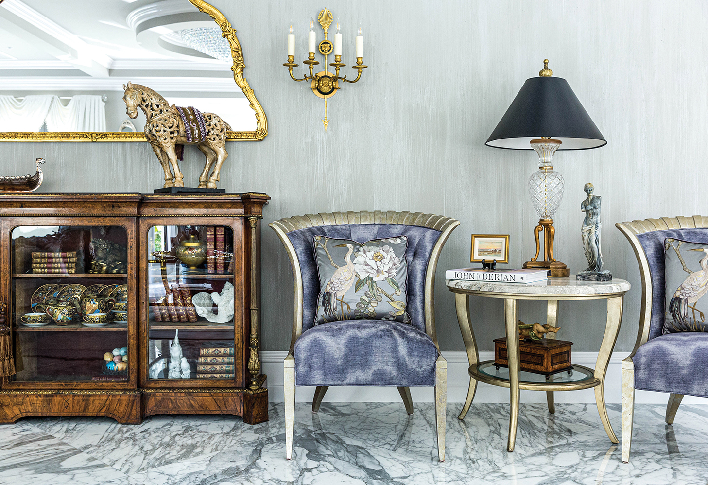 Arm chair with shades of blue and ornate furnishings