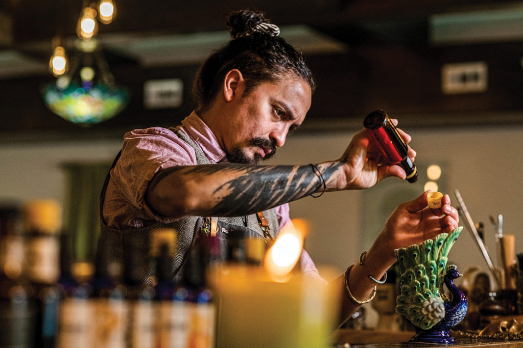Bartender creating a specialty craft cocktail