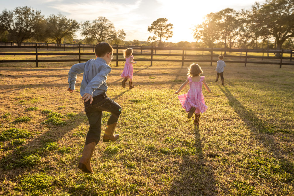 Children running on the family farm