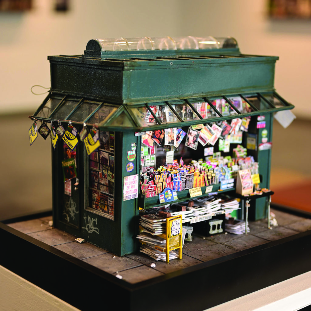 Miniature urban scene of newspaper stand
