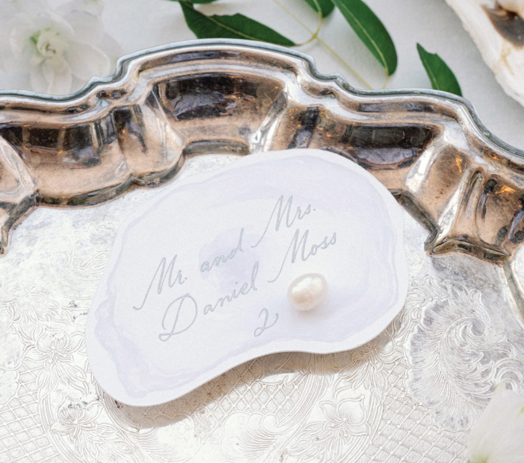 Guest name painted onto oyster shell