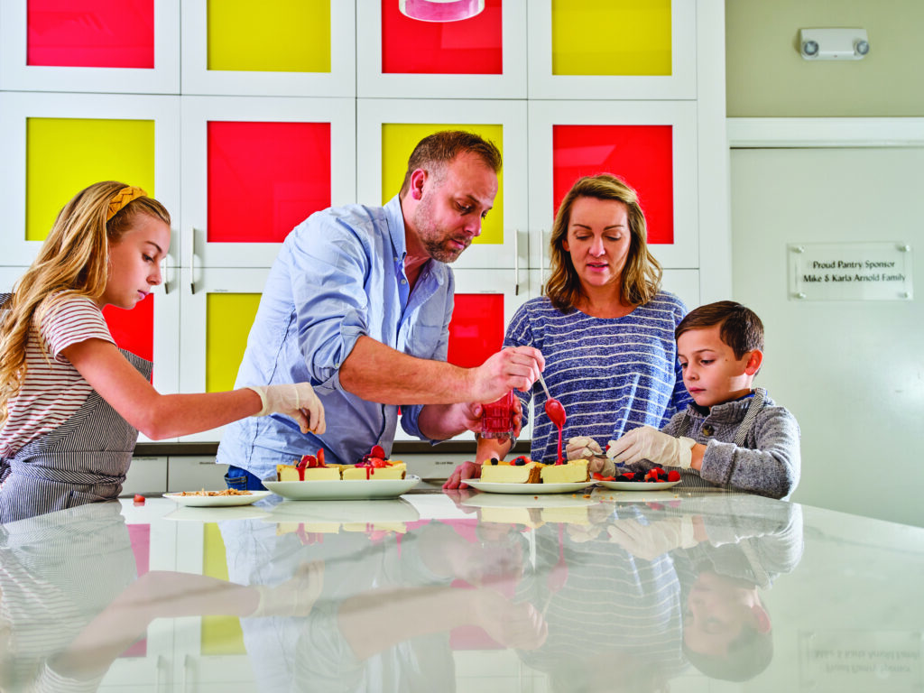 Chef Adam Nardis and his wife, Erin, with two of their kids