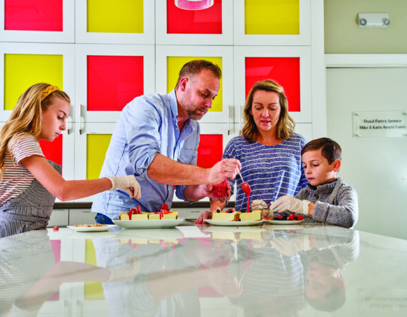 Chef Adam Nardis and his wife, Erin, with two of their kids