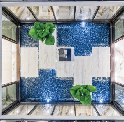 Aerial view of an indoor pool with walkway